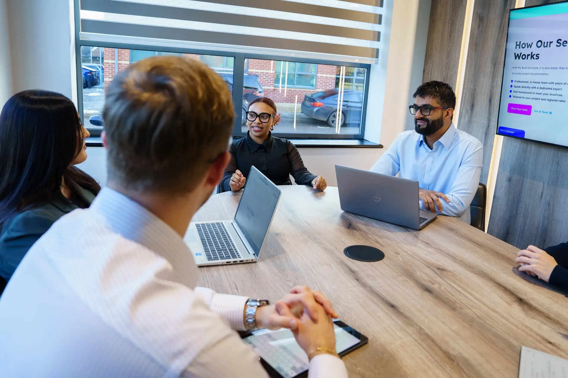 Group of People Sitting Around a Table